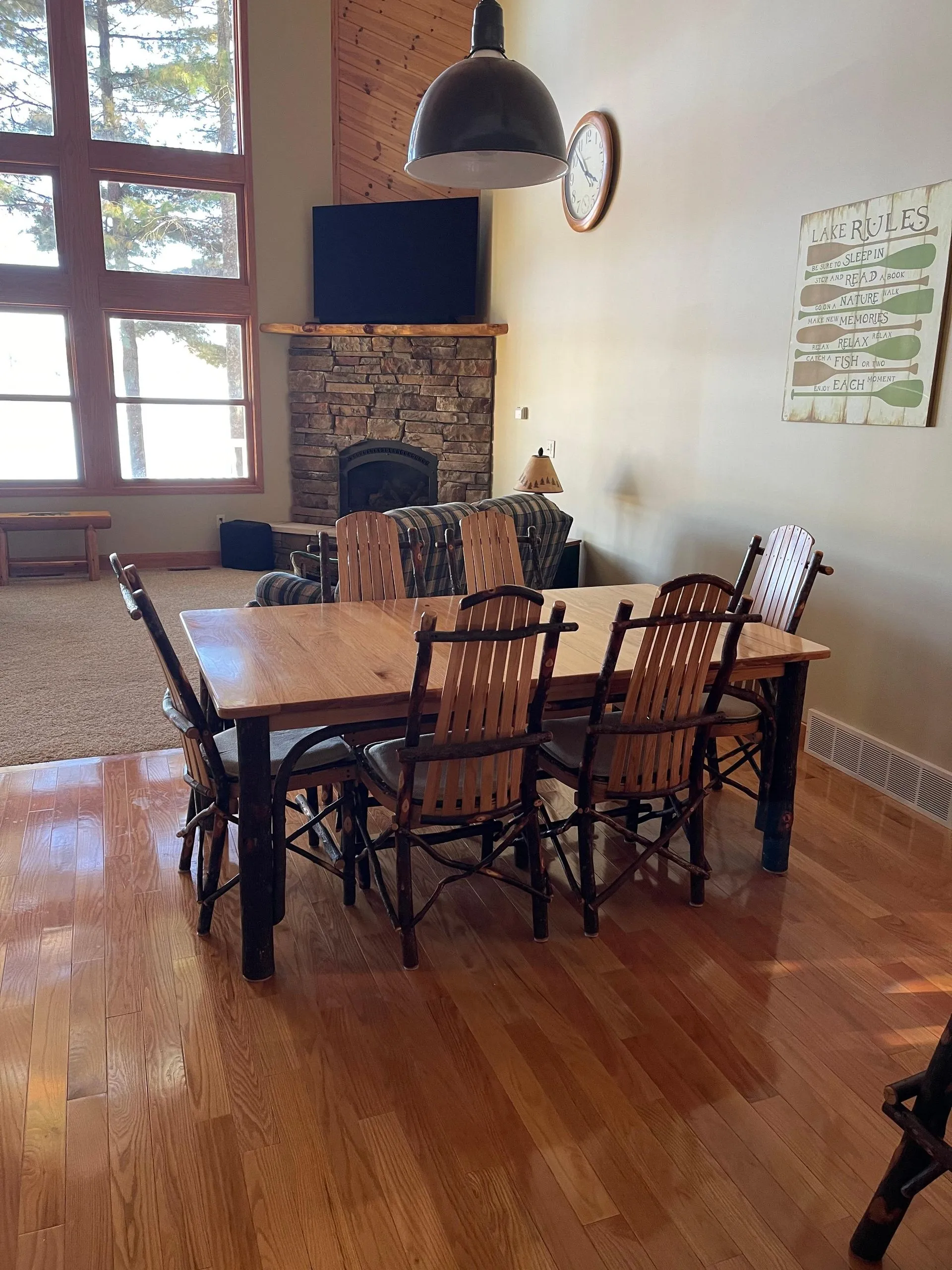 an image of a dining area with wooden dining table and chairs