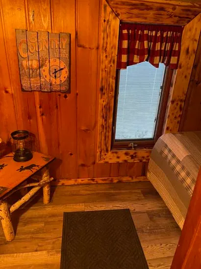An image of a well lit and clean bed room